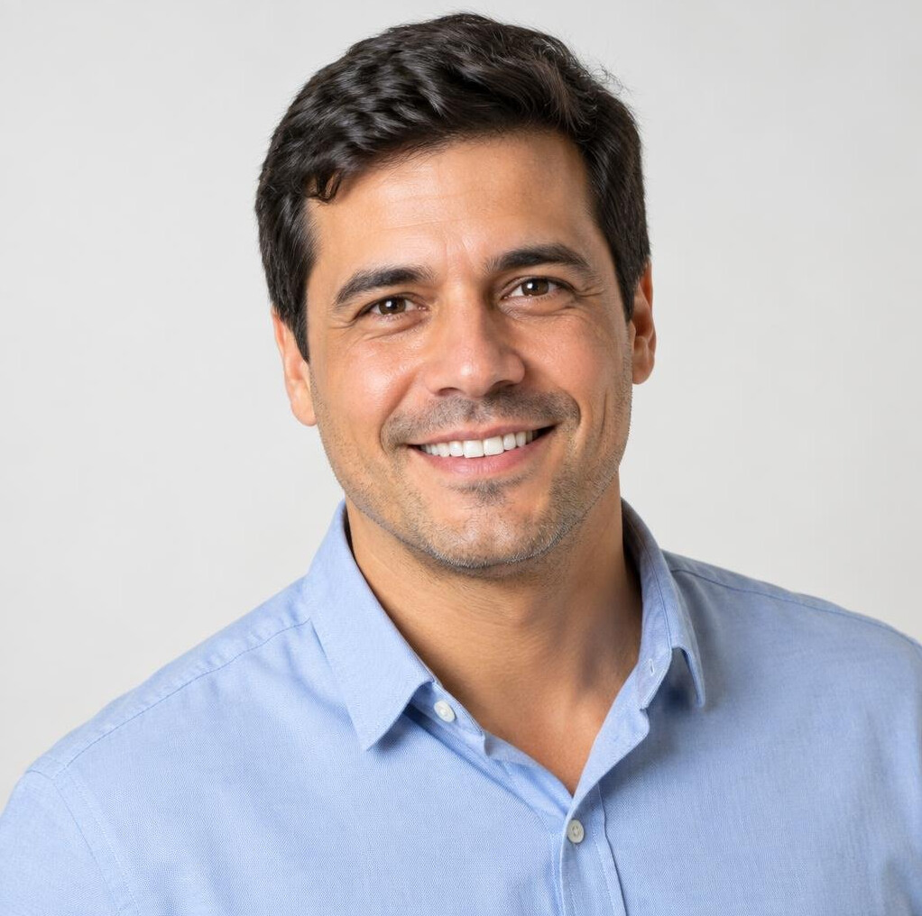 Portrait of a Brazilian facilitator smiling confidently