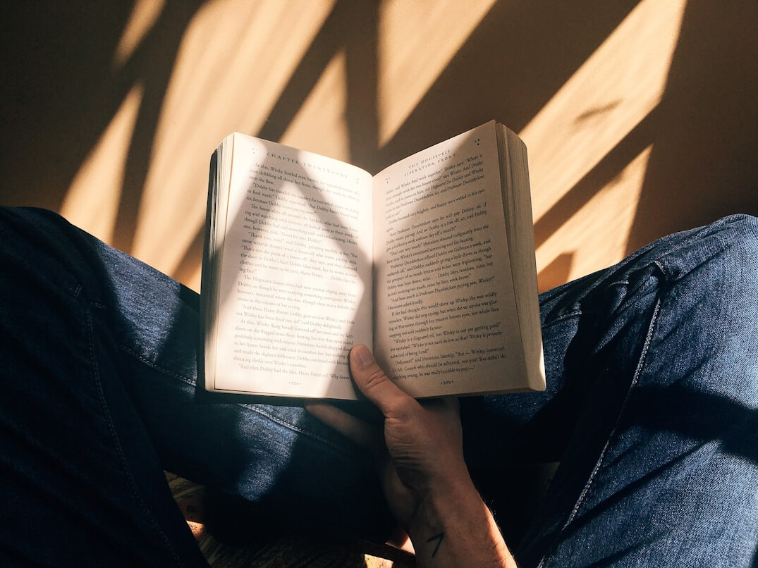 person reading self help book