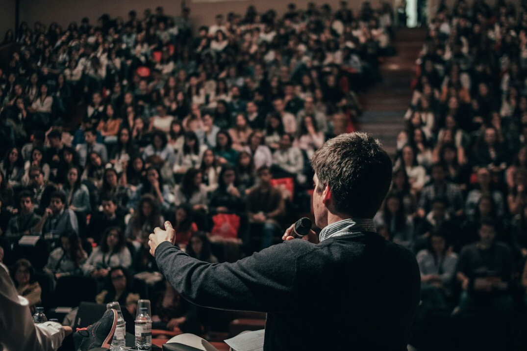 confident person speaking to audience